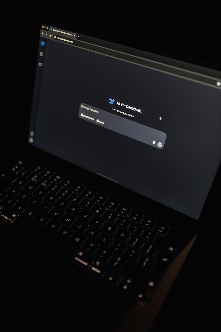 A dark-themed laptop screen displaying the DeepSeek AI interface, highlighting modern technology.