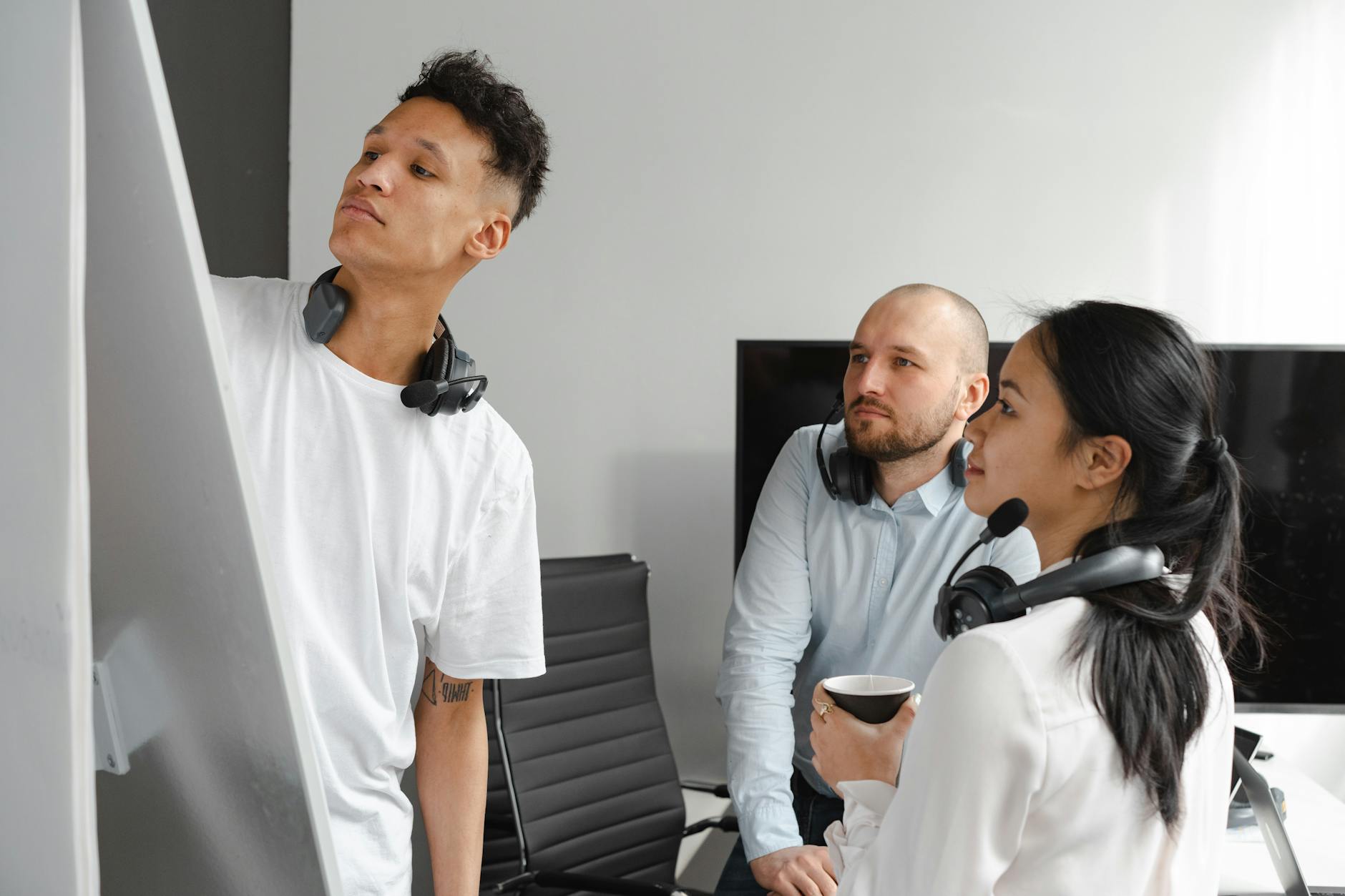 A diverse group of professionals engaged in a dynamic team brainstorming session.