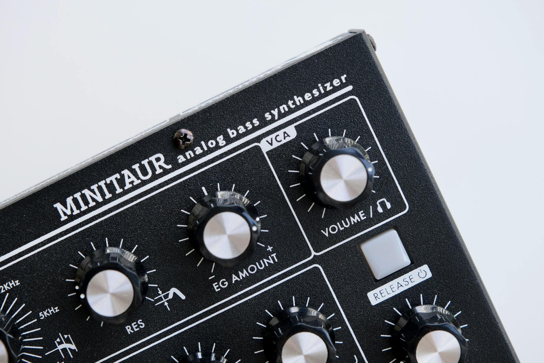 Detailed image of Minitaur analog bass synthesizer showcasing controls and dials.