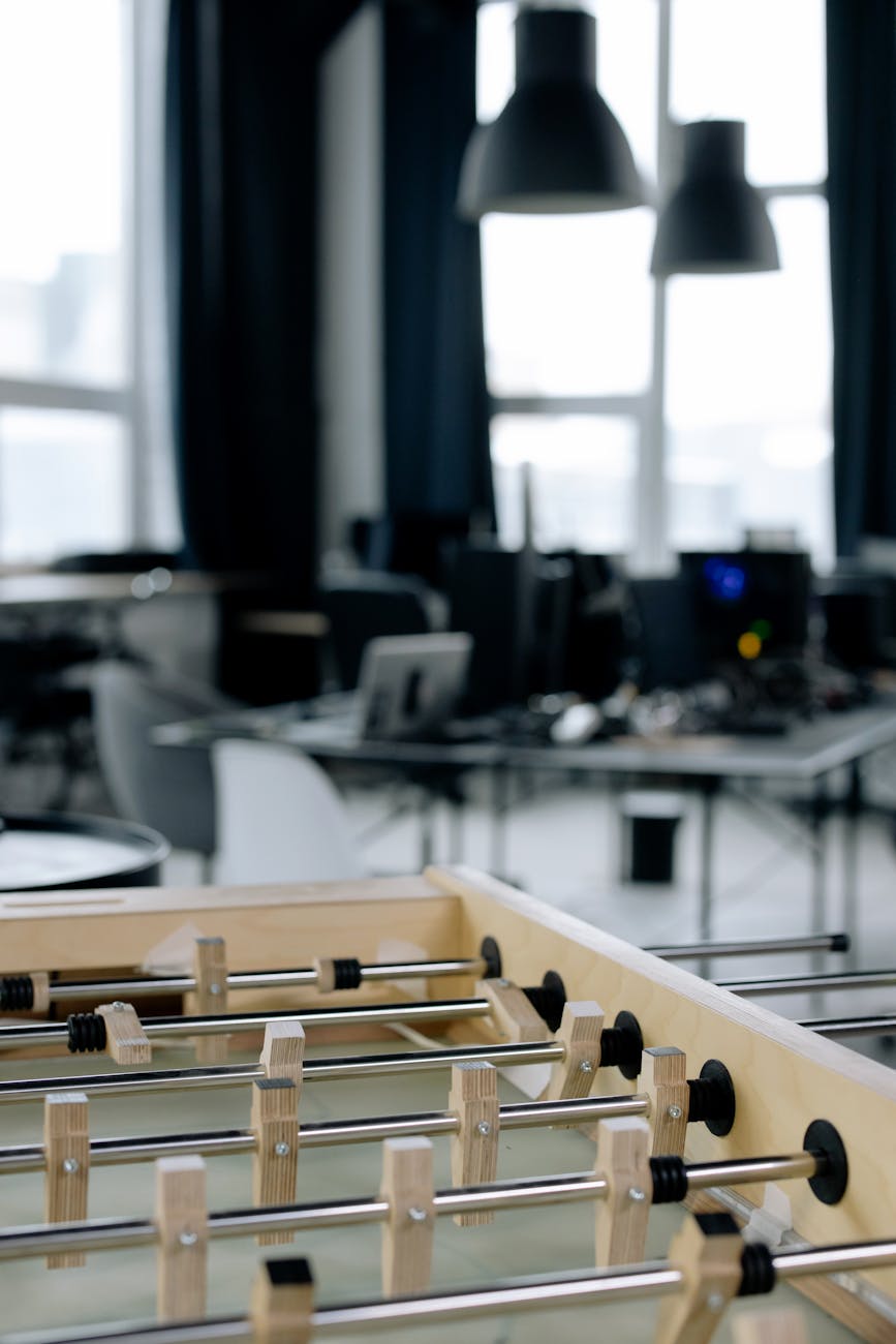 Creative workspace with foosball table in modern startup office setting