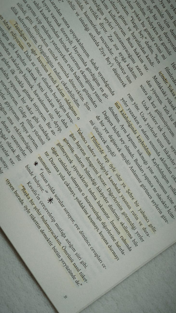 Open book with highlighted text on a page, angled view.