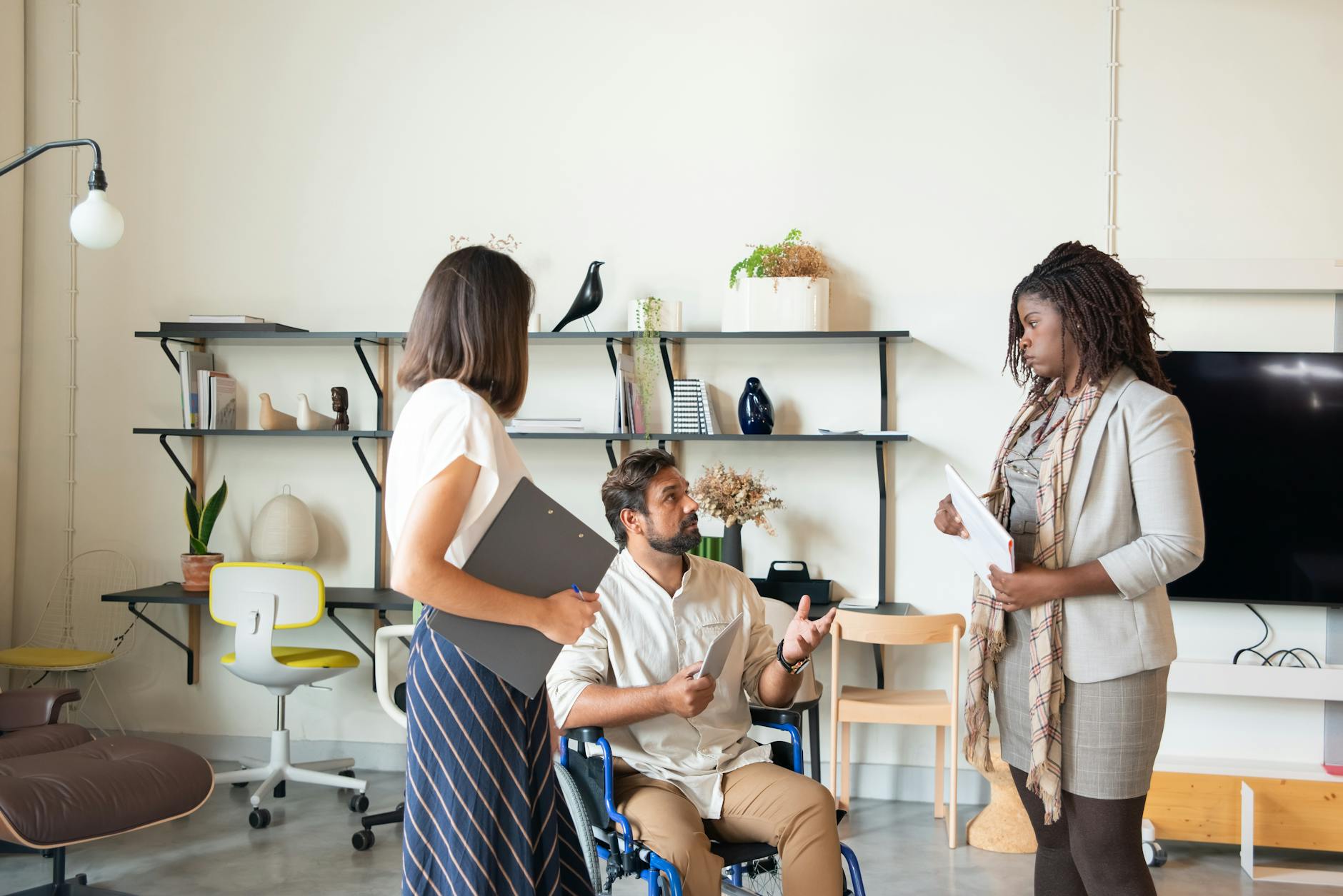 Business team of diverse professionals discussing strategies in a modern office setting.